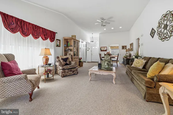 a bedroom with furniture and a chandelier