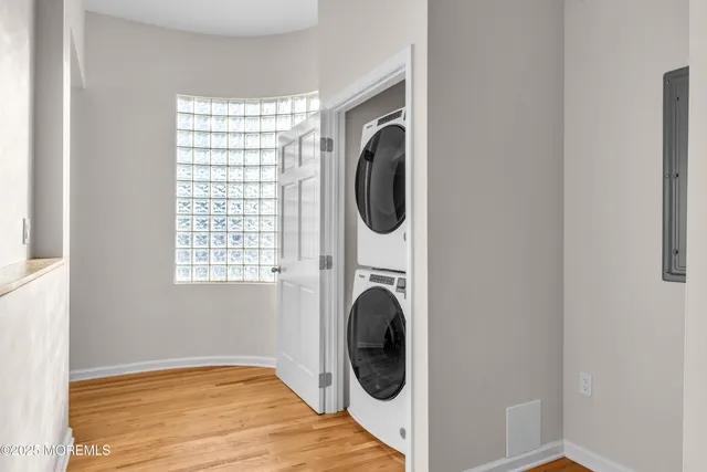 a view of a hallway with washer and dryer
