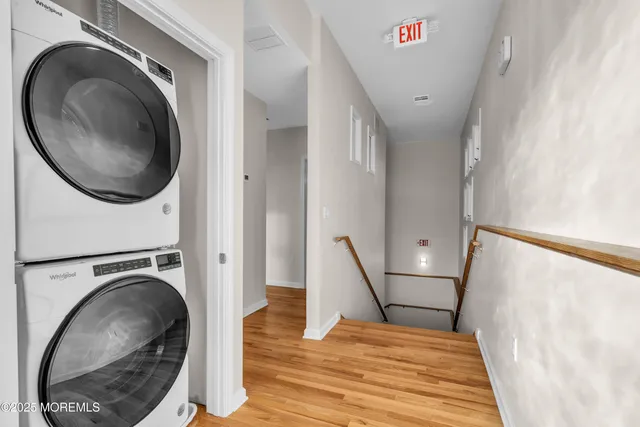 a view of a hallway with washer and dryer