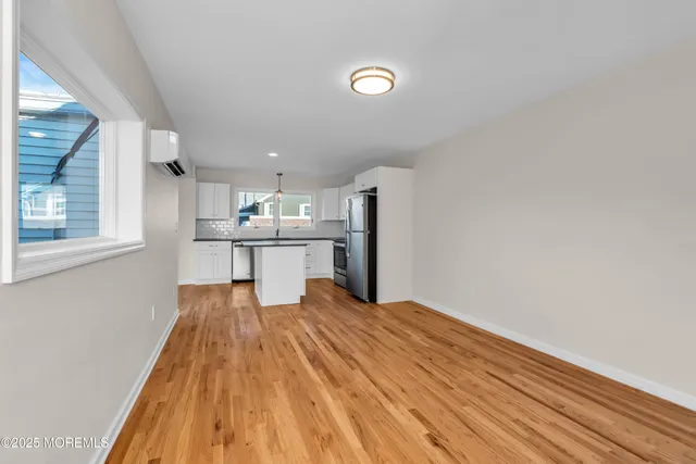 a view of kitchen with wooden floor