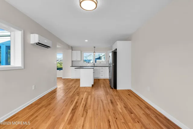 a view of kitchen with wooden floor