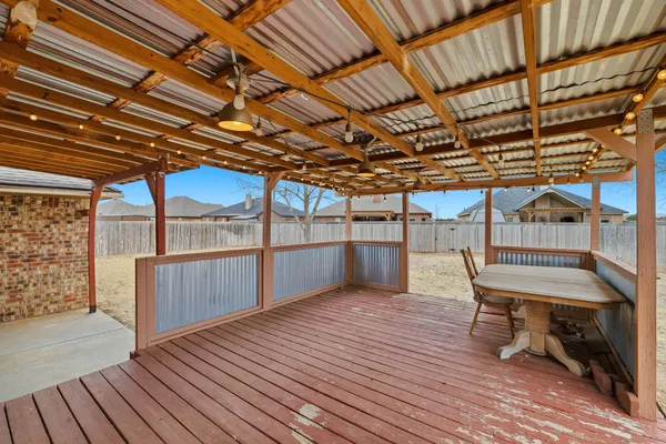 a backyard of house with wooden fence