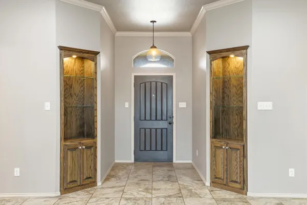 an empty room with closet and a bathroom