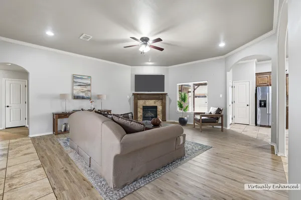 a living room with furniture and a fireplace