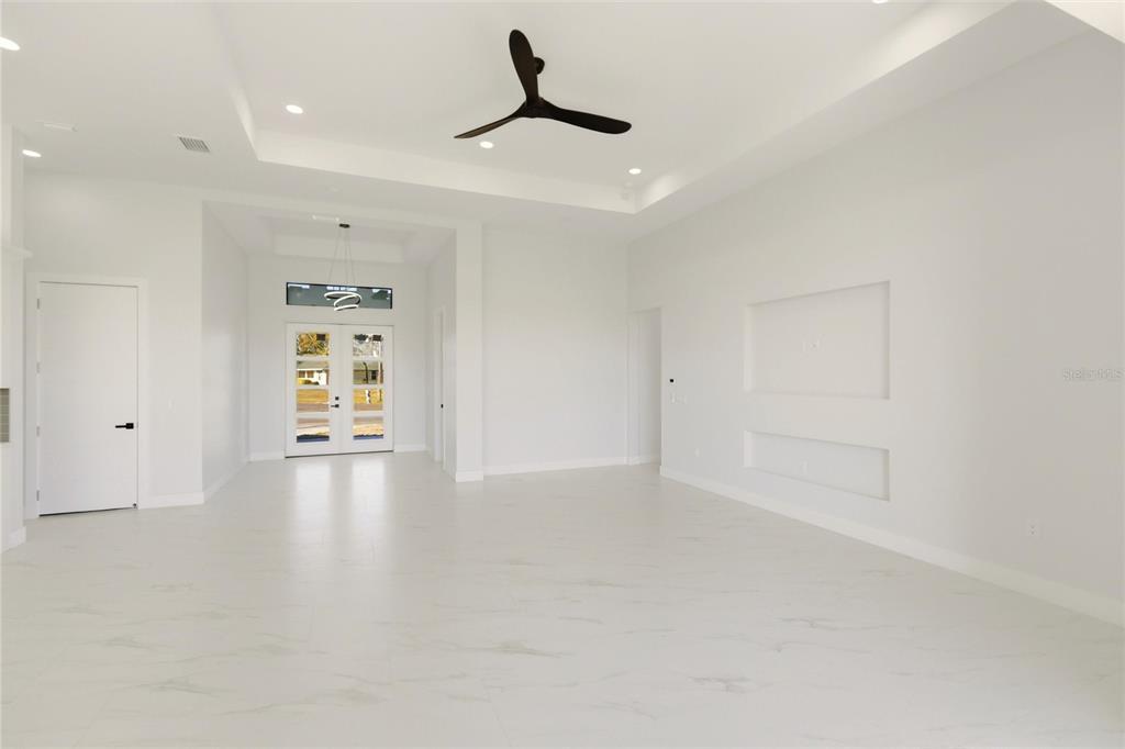 17 Long Meadow Road Rotonda West, FL 33947 - Photo 9 of 37 a view of an empty room with a window