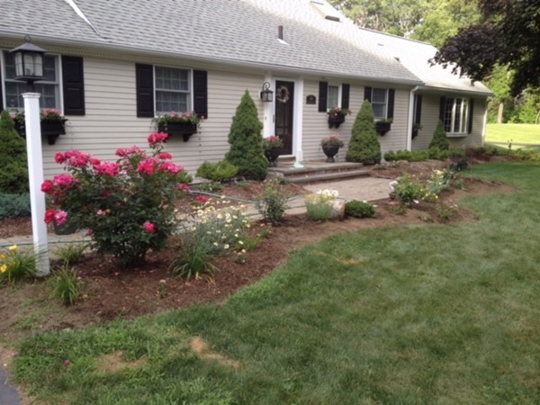 99 Parmenter Road Framingham, MA 01701 - Photo 3 of 30 a front view of a house with a yard and outdoor seating