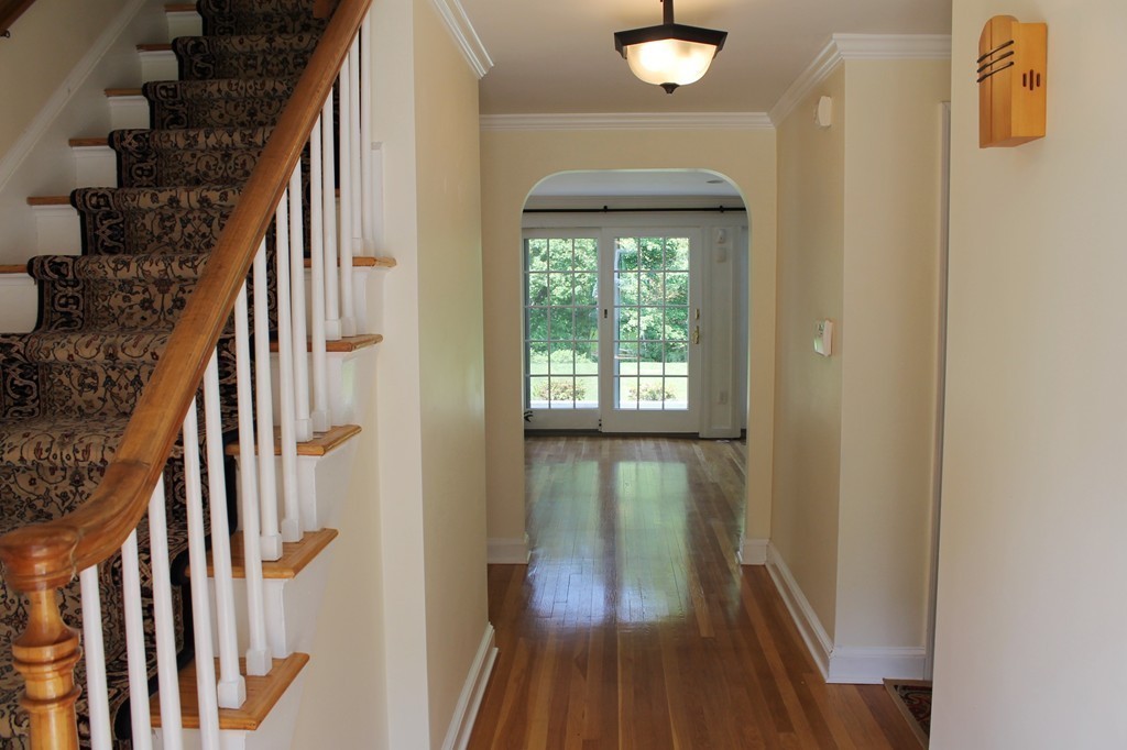 99 Parmenter Road Framingham, MA 01701 - Photo 5 of 30 a view of hallway with wooden floor and staircase
