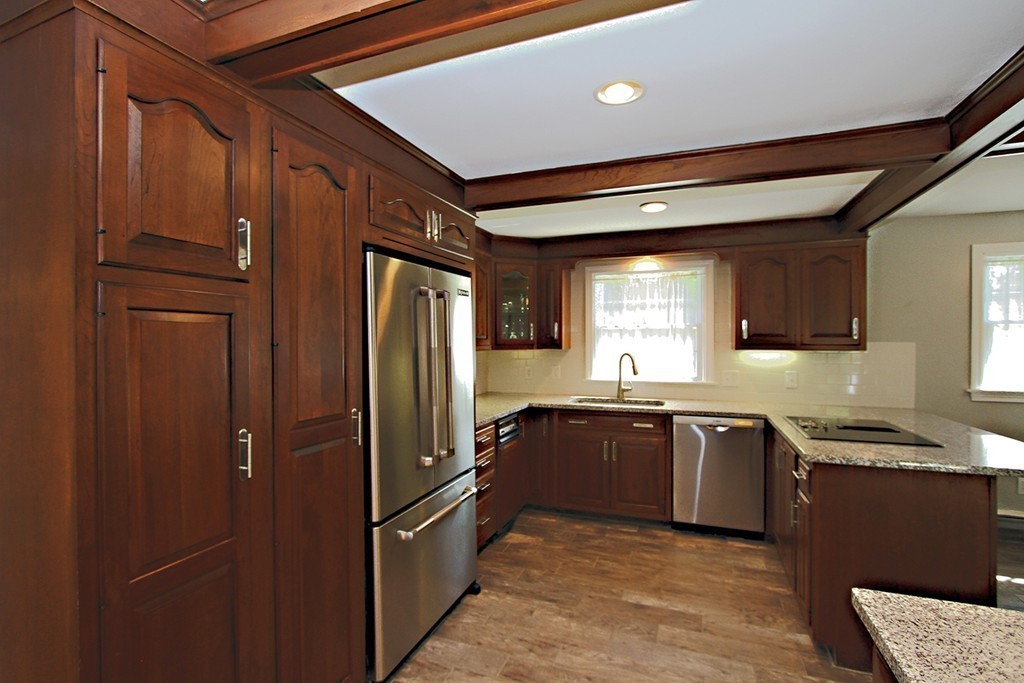 99 Parmenter Road Framingham, MA 01701 - Photo 6 of 30 a kitchen with stainless steel appliances granite countertop a refrigerator a sink and dishwasher