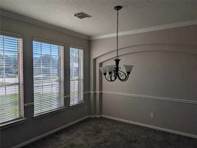 a view of water heater room with window