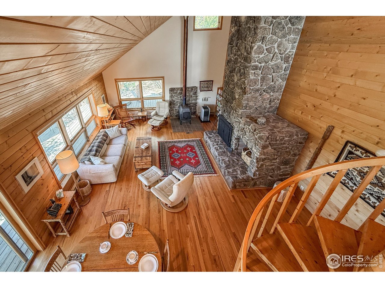 18673 Highway 7 Lyons, CO 80540 - Photo 30 of 39 Over looking the heart of the cabin from the loft/sleeping space atop the spiral staircase