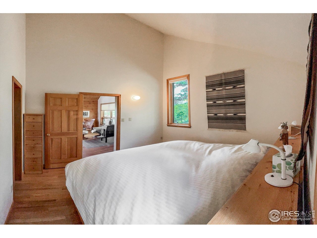 18673 Highway 7 Lyons, CO 80540 - Photo 32 of 39 Primary bedroom with custom made king size bed