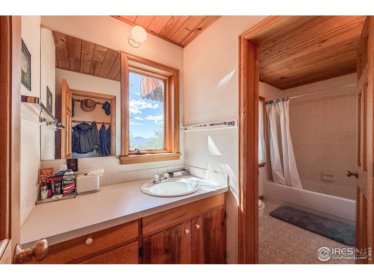 18673 Highway 7 Lyons, CO 80540 - Photo 39 of 39 Main floor bathroom separates shower from vanity space to accomodate as many or as few people as you wish to have in your remarkable mountain estate
