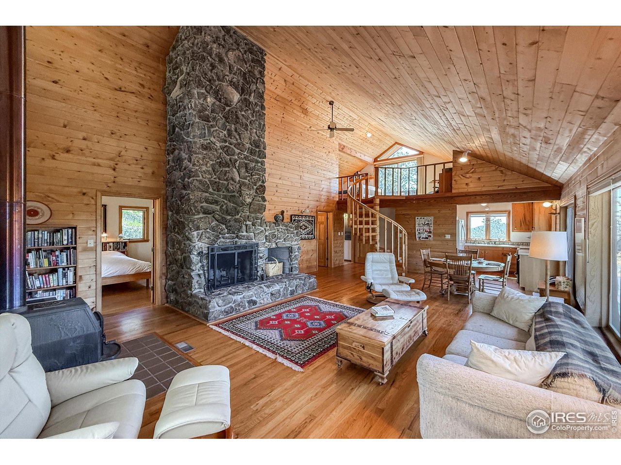 18673 Highway 7 Lyons, CO 80540 - Photo 6 of 39 The thoughfully designed cabin is bathed in natural light and imbued with a sense of warmth that instantly feels like home