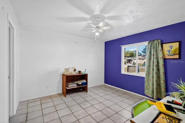 a view of room with cabinets and window