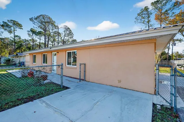 a balcony with couple of potted plants