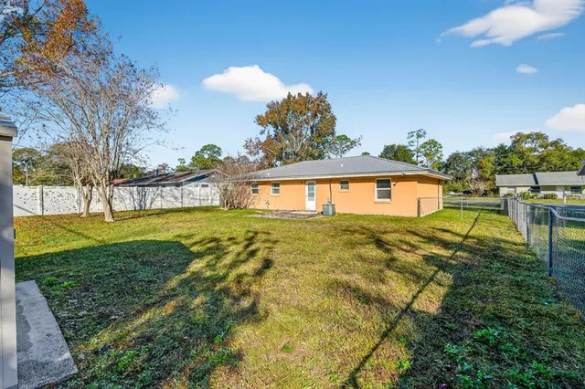a view of yard with swimming pool