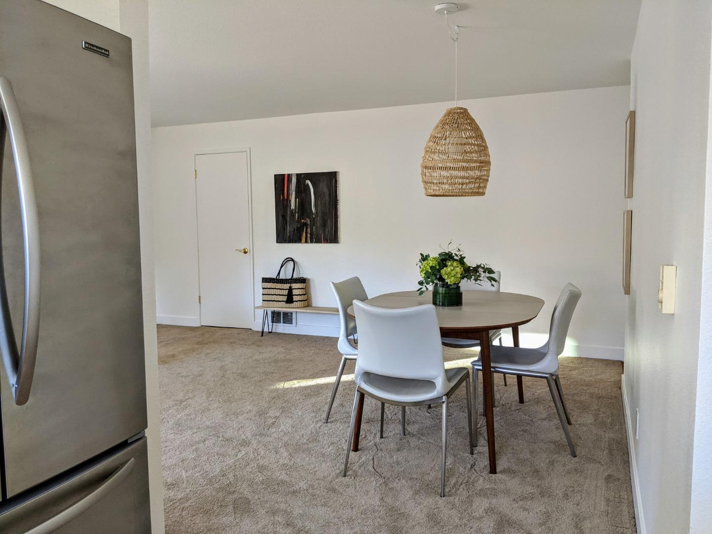 666 Encore Way San Jose, CA 95134 - Photo 14 of 41 a view of a dining room with furniture
