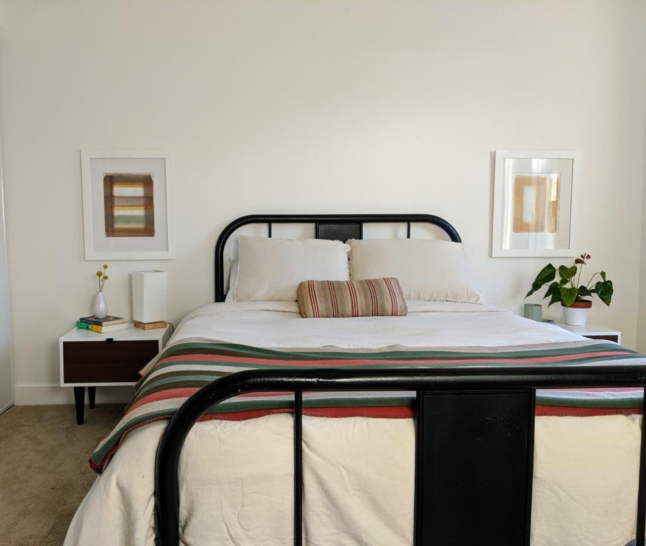 666 Encore Way San Jose, CA 95134 - Photo 22 of 41 a bedroom with a bed and a potted plant on dresser