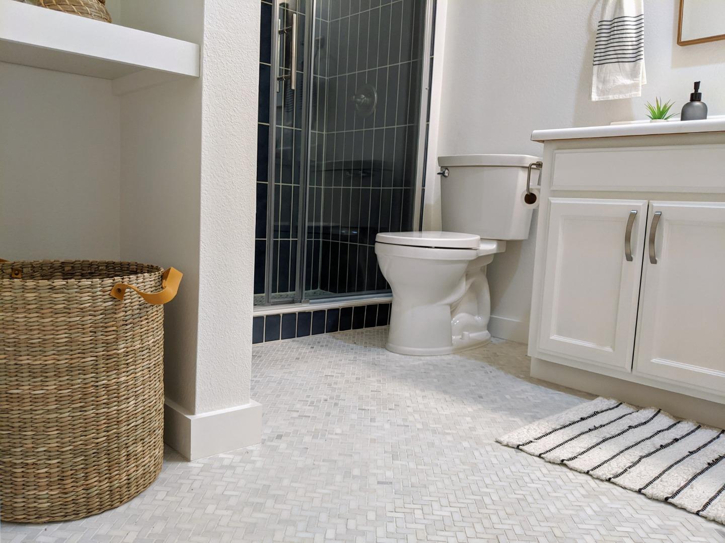 666 Encore Way San Jose, CA 95134 - Photo 26 of 41 a view of a bathroom with a sink and toilet