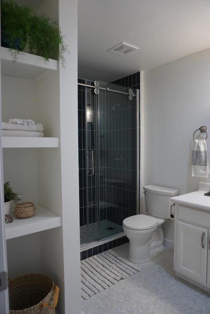 666 Encore Way San Jose, CA 95134 - Photo 29 of 41 a bathroom with a sink toilet and shower
