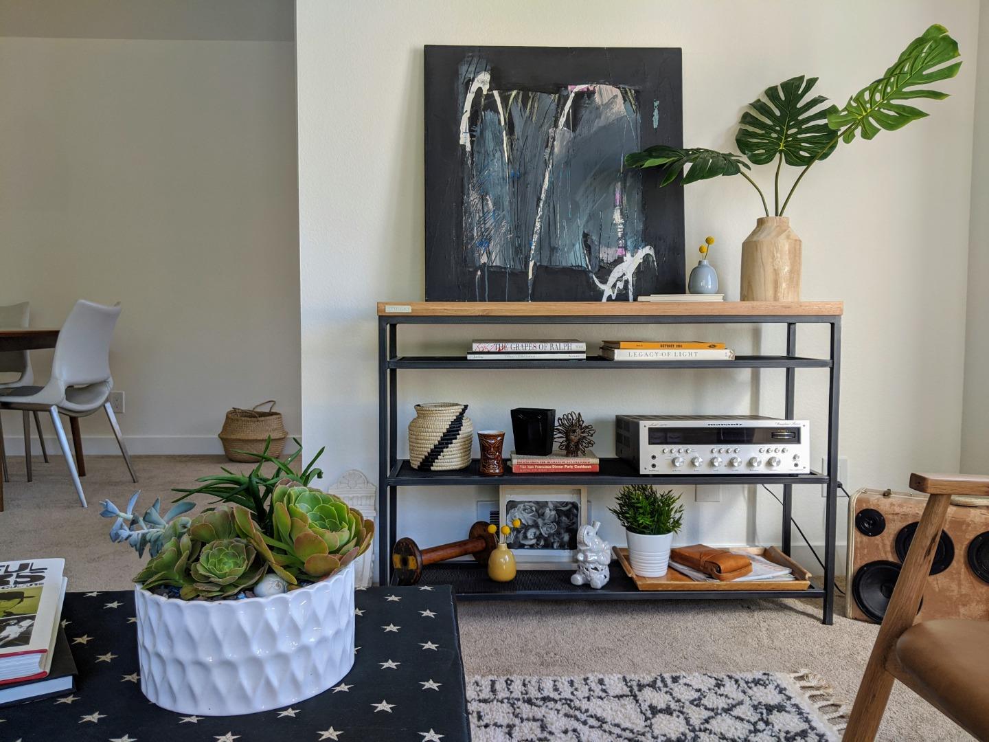 666 Encore Way San Jose, CA 95134 - Photo 3 of 41 a room with a couch and a potted plant