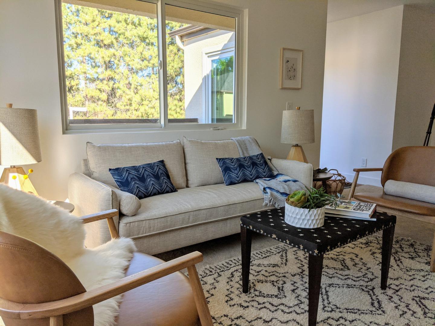 666 Encore Way San Jose, CA 95134 - Photo 4 of 41 a living room with furniture and a large window