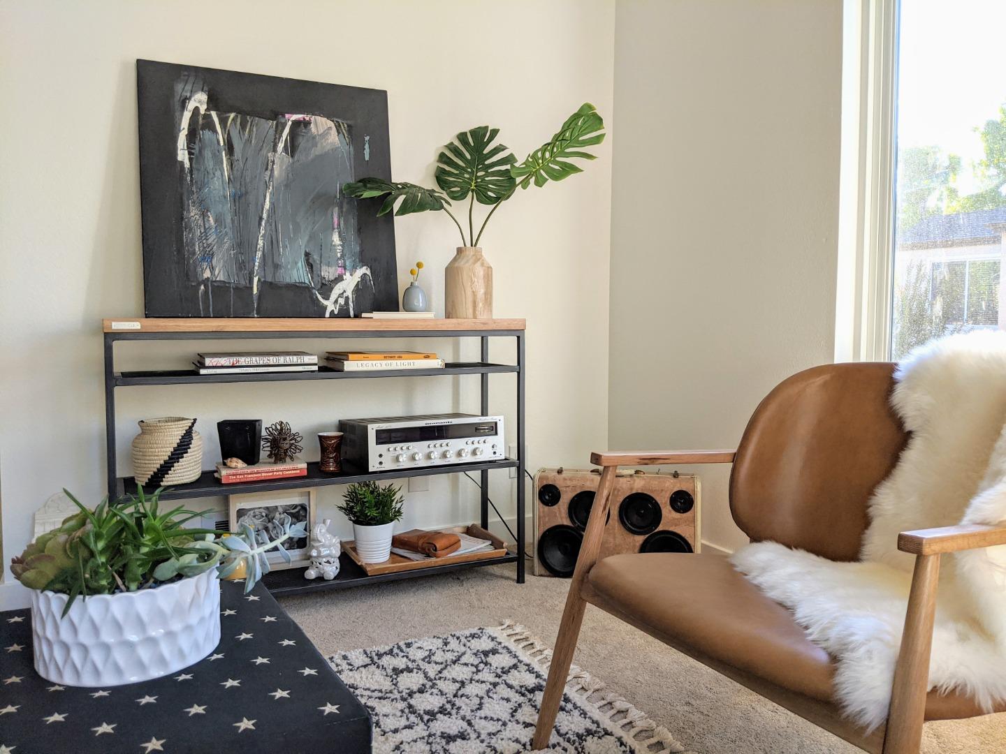 666 Encore Way San Jose, CA 95134 - Photo 7 of 41 a living room with furniture and a potted plant