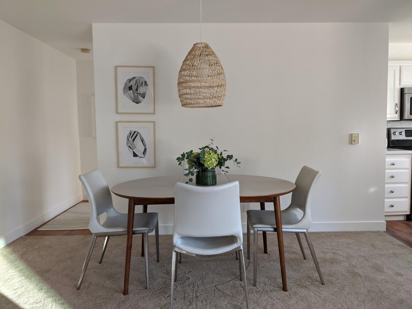 666 Encore Way San Jose, CA 95134 - Photo 8 of 41 a view of a dining room with furniture and a potted plant