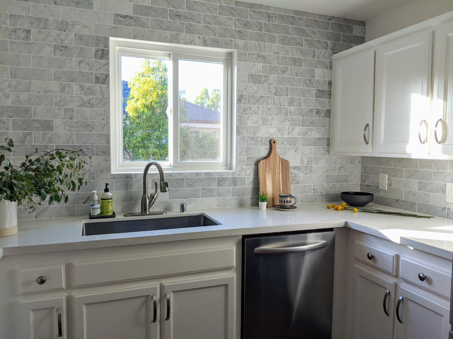 666 Encore Way San Jose, CA 95134 - Photo 9 of 41 a kitchen with a sink cabinets and a window