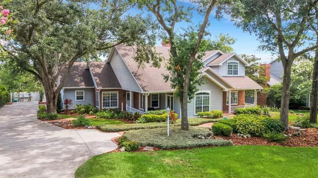 a front view of house with a garden