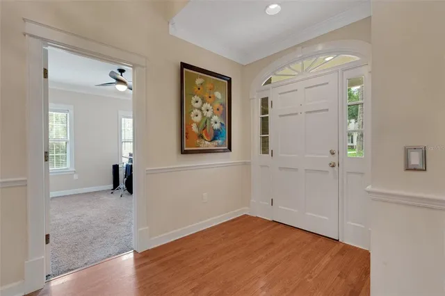 a bedroom with a large bed and a large window