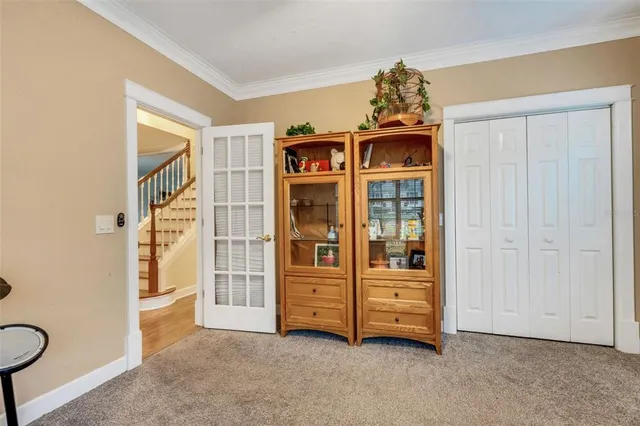 a bath tub sitting in a bathroom next to a window