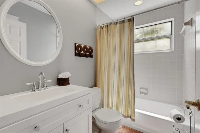 a view of a livingroom with furniture and a large window