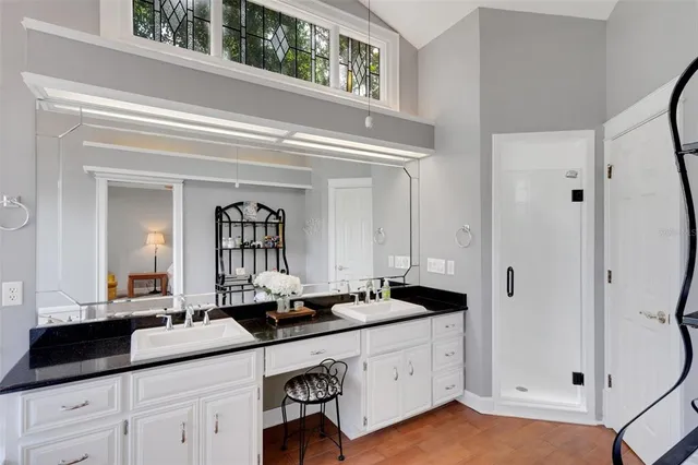 a view of a dining room with furniture and a chandelier