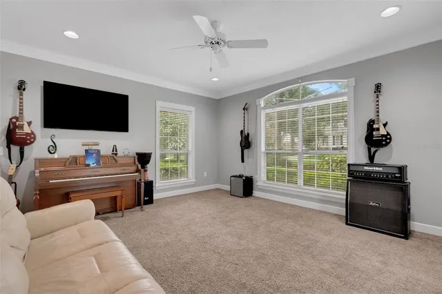 a kitchen with a center island refrigerator and cabinets