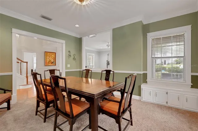 a kitchen with granite countertop a sink stainless steel appliances and cabinets