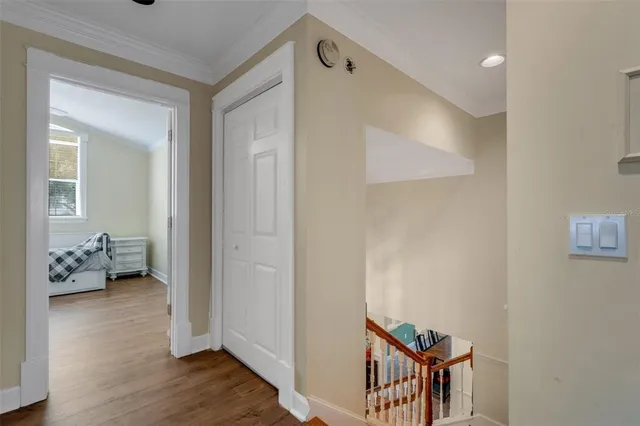 a kitchen with white cabinets and sink