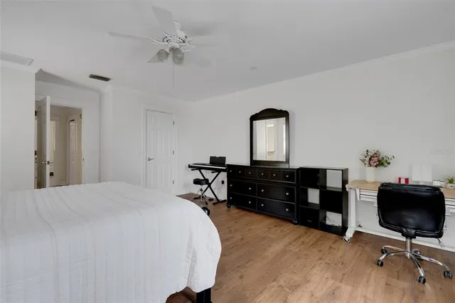 a view of a livingroom with lounge chair and a window