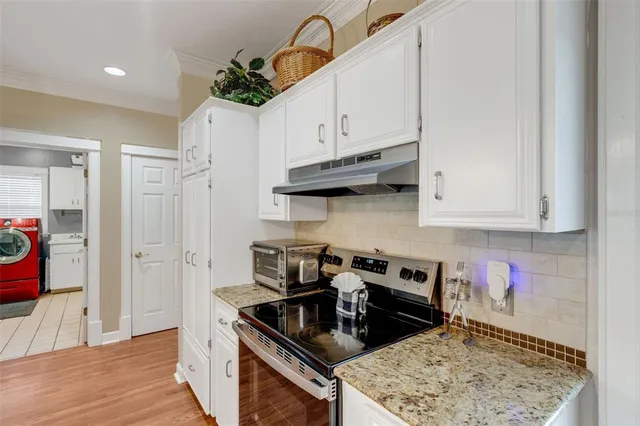 an aerial view of residential house with outdoor space and swimming pool