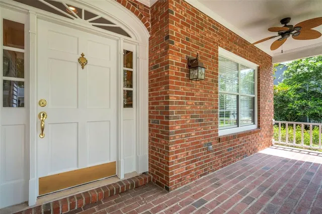 a view of a livingroom with workspace and a window