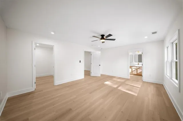 a view of a house with a yard covered in snow