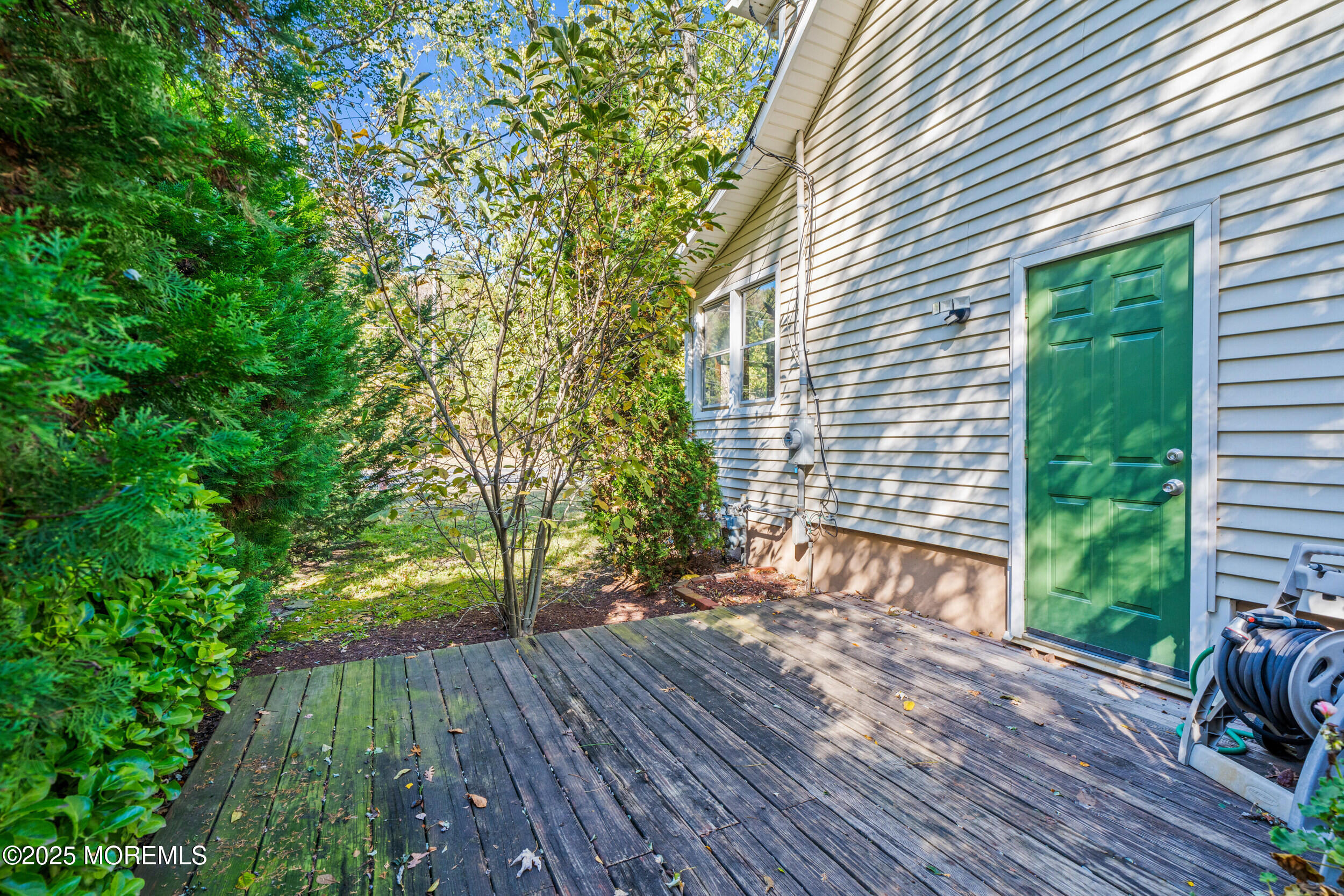 3020 Shafto Road Tinton Falls, NJ 07753 - Photo 17 of 42 a view of backyard with a deck and wooden floor