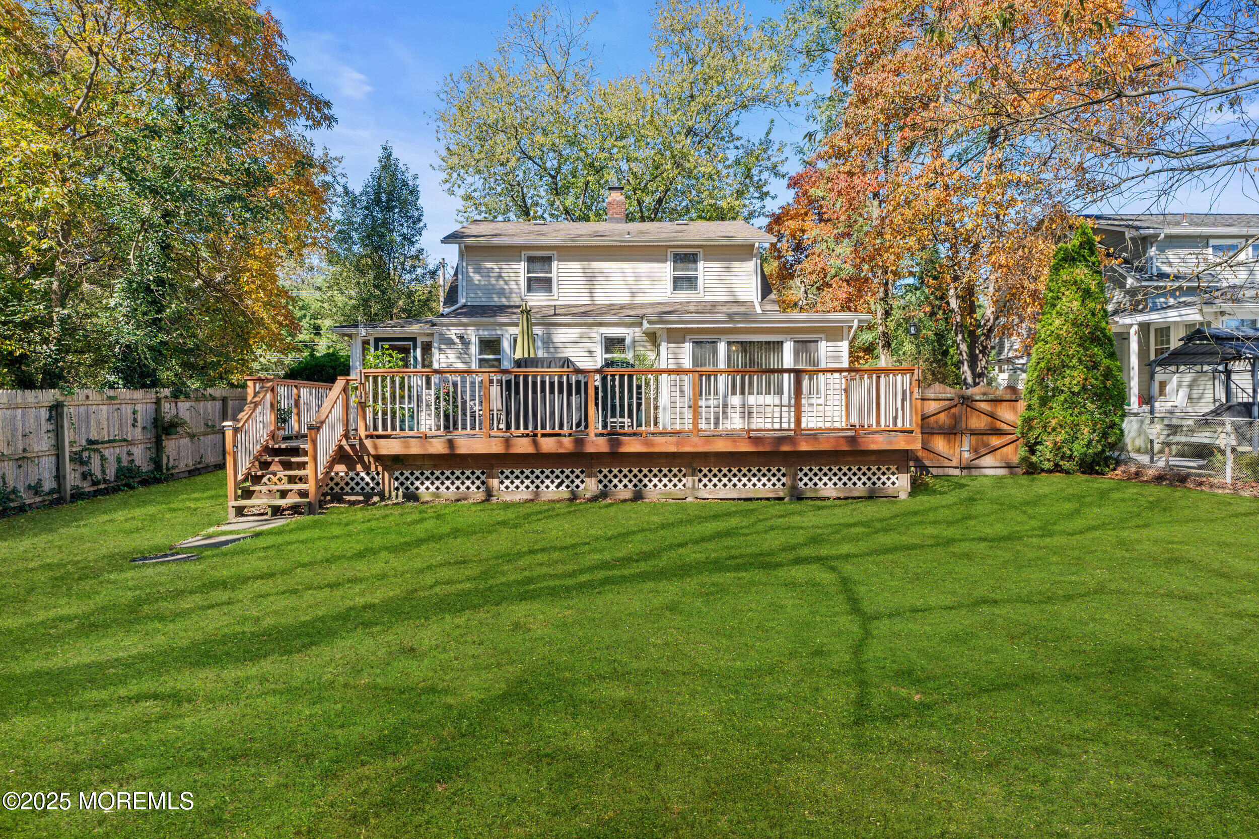 3020 Shafto Road Tinton Falls, NJ 07753 - Photo 20 of 42 a view of a house with a backyard and a patio