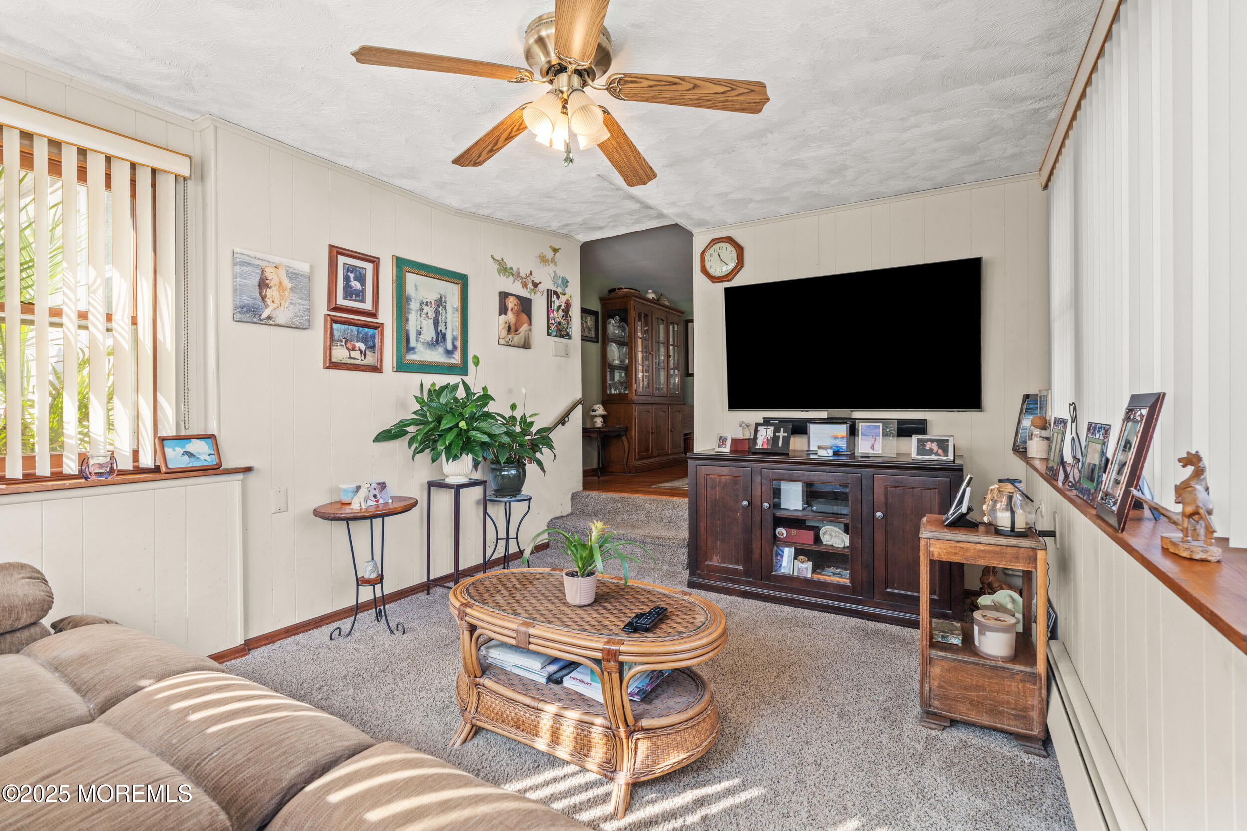 3020 Shafto Road Tinton Falls, NJ 07753 - Photo 29 of 42 a living room with furniture and a flat screen tv