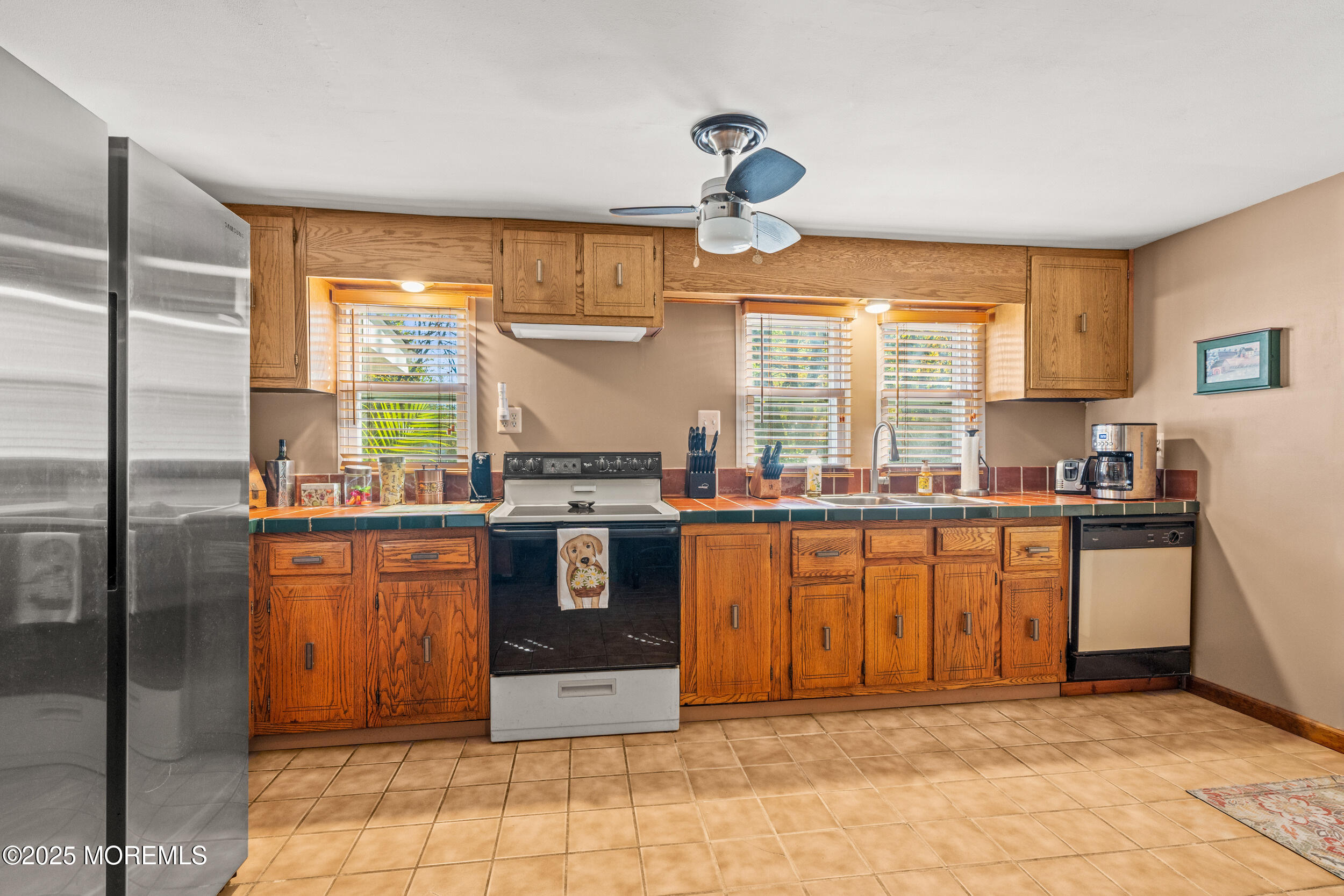 3020 Shafto Road Tinton Falls, NJ 07753 - Photo 32 of 42 a kitchen with stainless steel appliances granite countertop a refrigerator and a sink