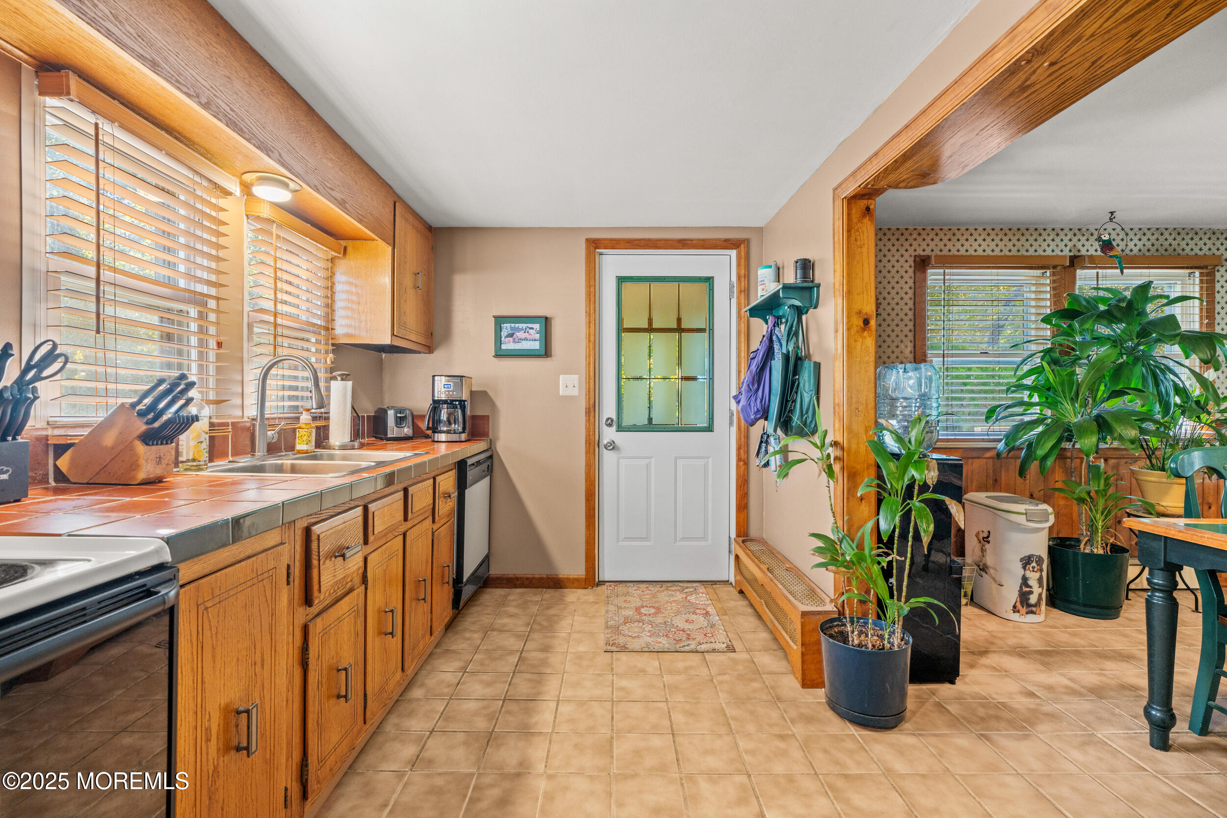 3020 Shafto Road Tinton Falls, NJ 07753 - Photo 33 of 42 a view of a kitchen with furniture and a potted plant