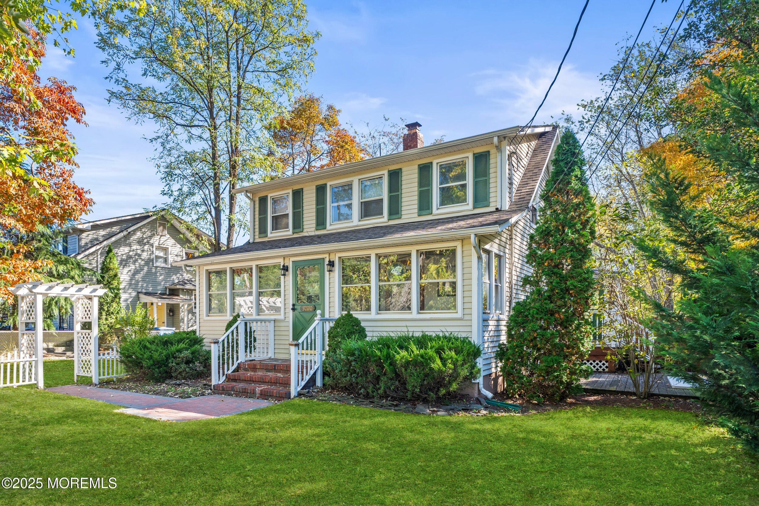 3020 Shafto Road Tinton Falls, NJ 07753 - Photo 40 of 42 a front view of a house with a yard and potted plants
