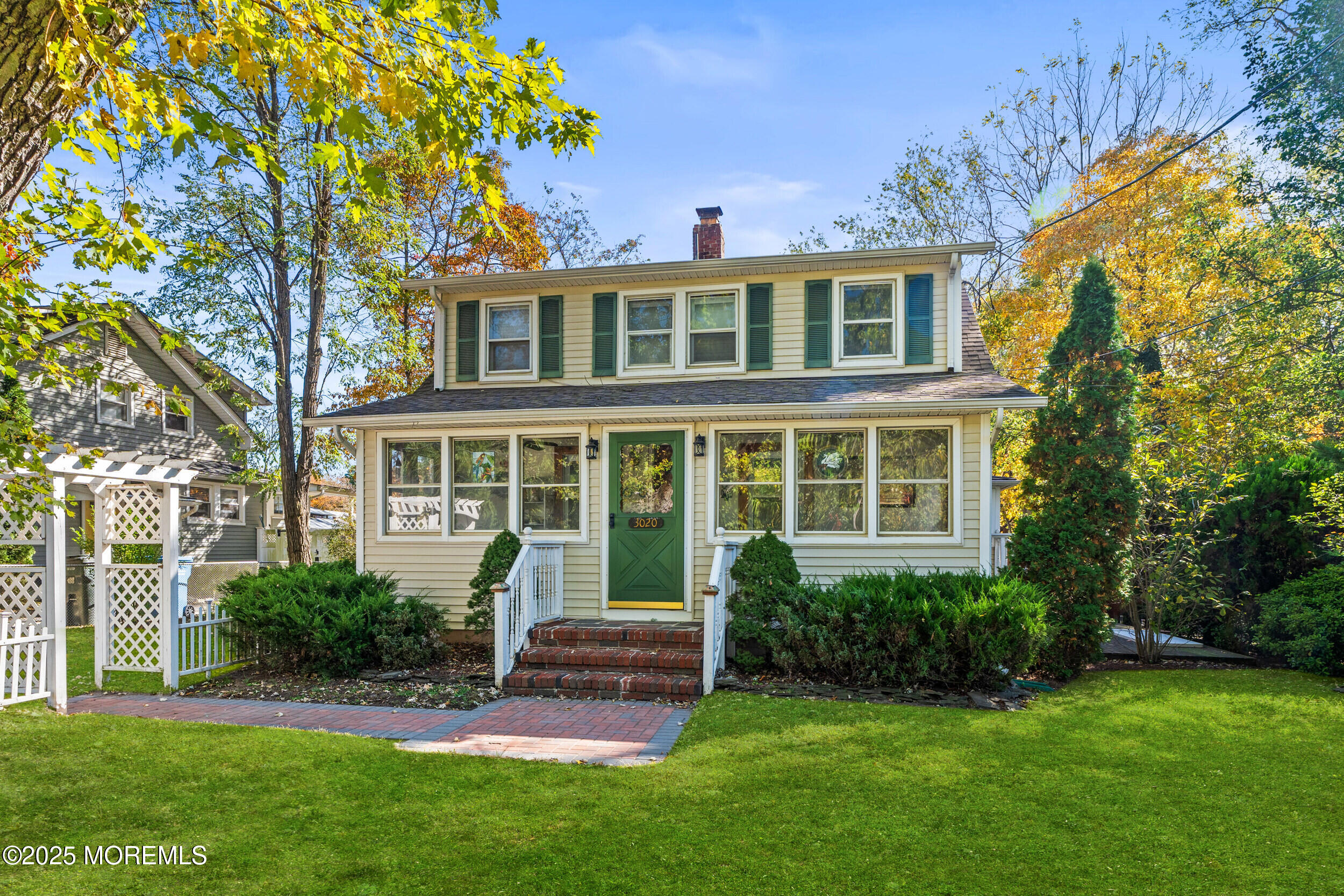 3020 Shafto Road Tinton Falls, NJ 07753 - Photo 42 of 42 a front view of a house with a yard and glass windows