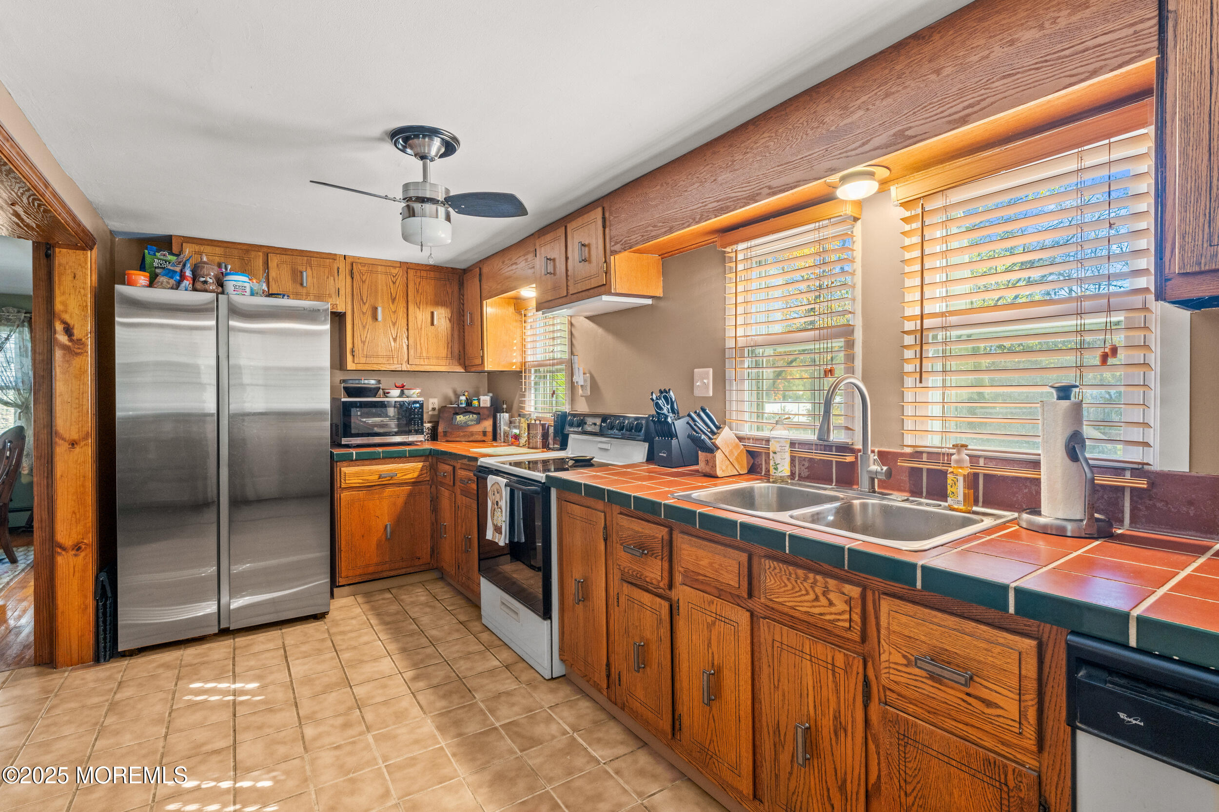 3020 Shafto Road Tinton Falls, NJ 07753 - Photo 5 of 42 a kitchen with stainless steel appliances granite countertop a sink a stove and refrigerator