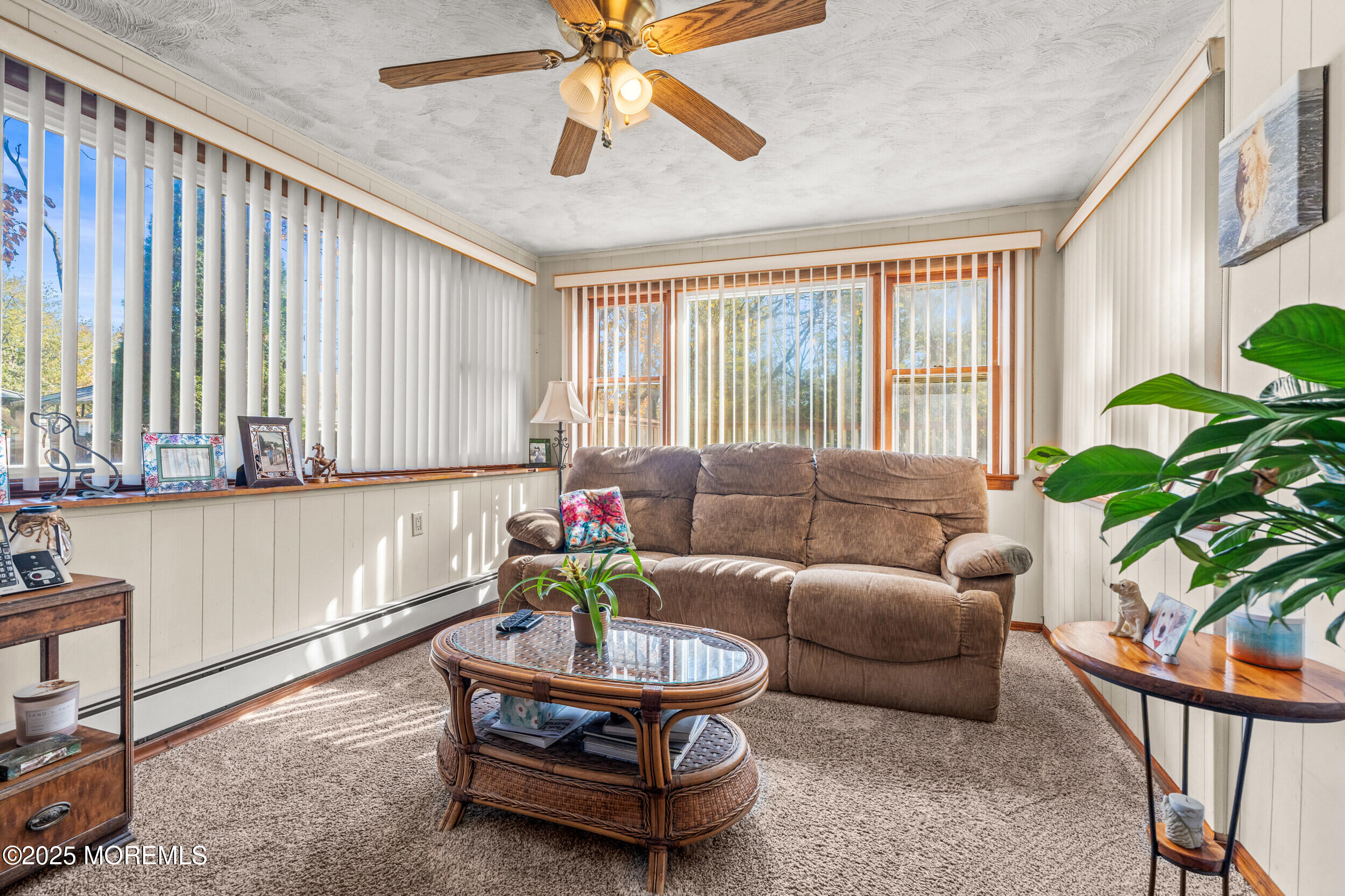 3020 Shafto Road Tinton Falls, NJ 07753 - Photo 6 of 42 a living room with furniture and a potted plant
